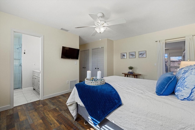 bedroom with dark hardwood / wood-style floors, ceiling fan, and ensuite bath