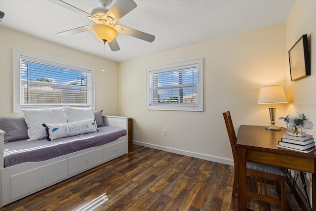 interior space with dark hardwood / wood-style floors and ceiling fan