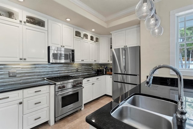 kitchen with white cabinetry, sink, appliances with stainless steel finishes, and tasteful backsplash