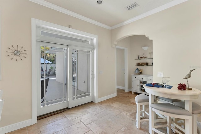 dining space featuring ornamental molding