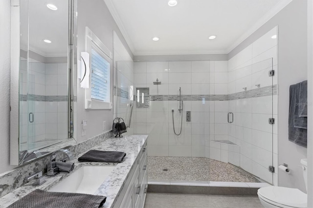 bathroom with vanity, toilet, crown molding, and walk in shower