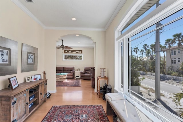 interior space featuring light hardwood / wood-style floors and ornamental molding