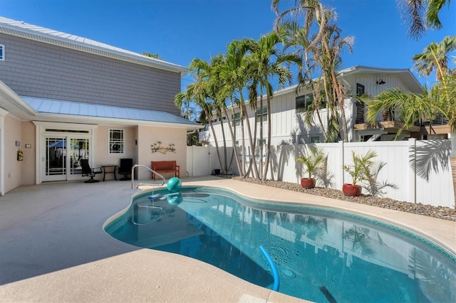 view of swimming pool featuring a patio area