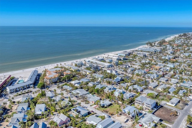 birds eye view of property featuring a water view and a view of the beach