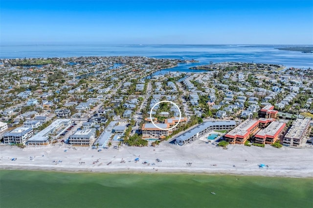 aerial view with a water view and a beach view