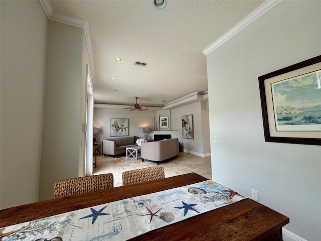 6405 Gulf Dr, Holmes Beach, FL 34217 - hall with visible vents, baseboards, crown molding, and a textured ceiling