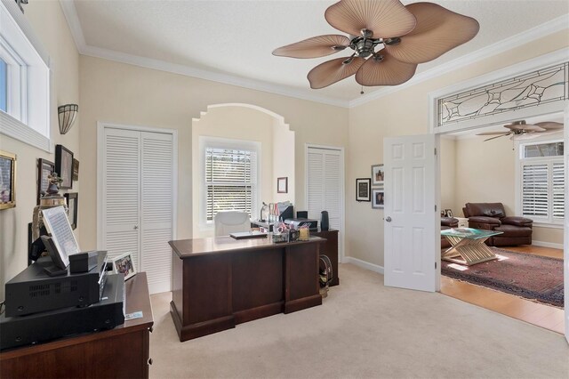 6405 Gulf Dr, Holmes Beach, FL 34217 - office area featuring baseboards, light carpet, a ceiling fan, crown molding, and arched walkways