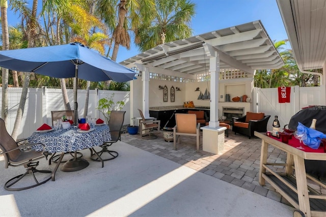 6405 Gulf Dr, Holmes Beach, FL 34217 - view of patio featuring a fenced backyard, outdoor dining area, and an outdoor hangout area