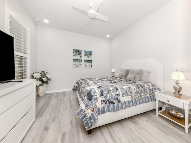 bedroom with ceiling fan and light wood-type flooring