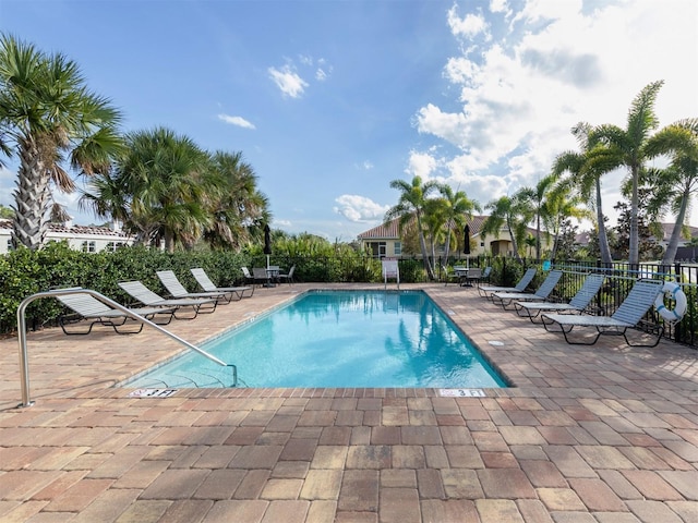 view of swimming pool with a patio area