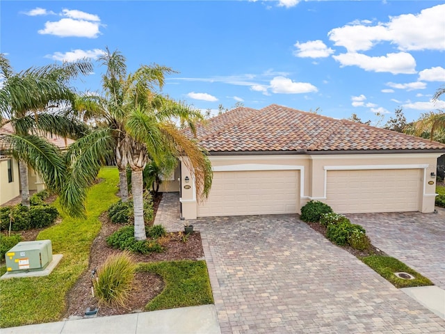 mediterranean / spanish-style home featuring a garage