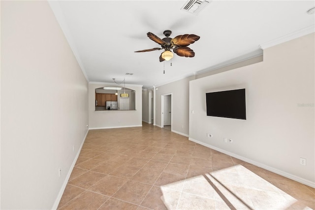 unfurnished living room featuring ceiling fan, light tile patterned flooring, and ornamental molding