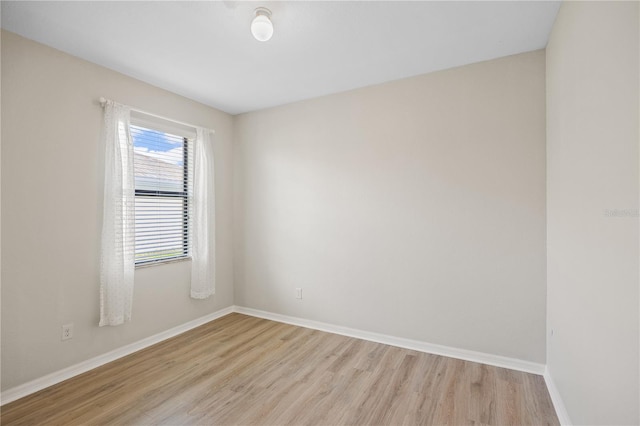 spare room featuring light wood-type flooring