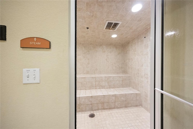 bathroom with tiled shower