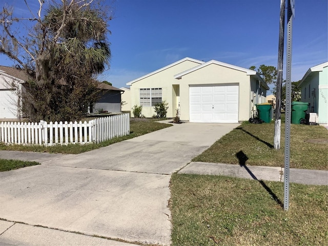 single story home with a garage and a front yard