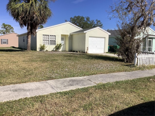 ranch-style house with a garage and a front lawn