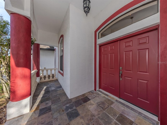 property entrance featuring covered porch