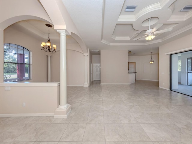 unfurnished room with plenty of natural light, ornamental molding, ceiling fan with notable chandelier, and a tray ceiling