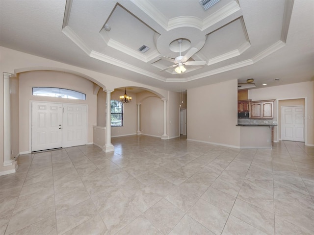 interior space featuring a tray ceiling, ceiling fan with notable chandelier, and ornamental molding