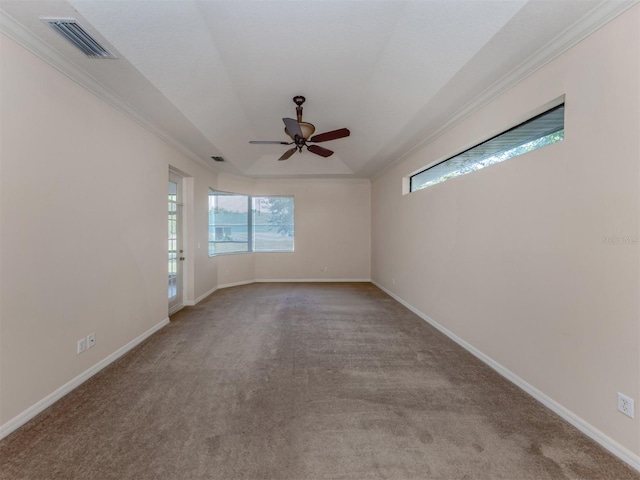 spare room with ceiling fan, ornamental molding, and light carpet