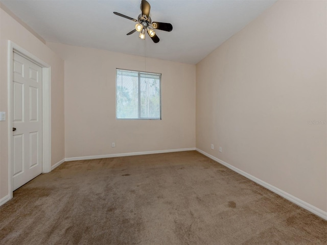 unfurnished room featuring ceiling fan and light colored carpet