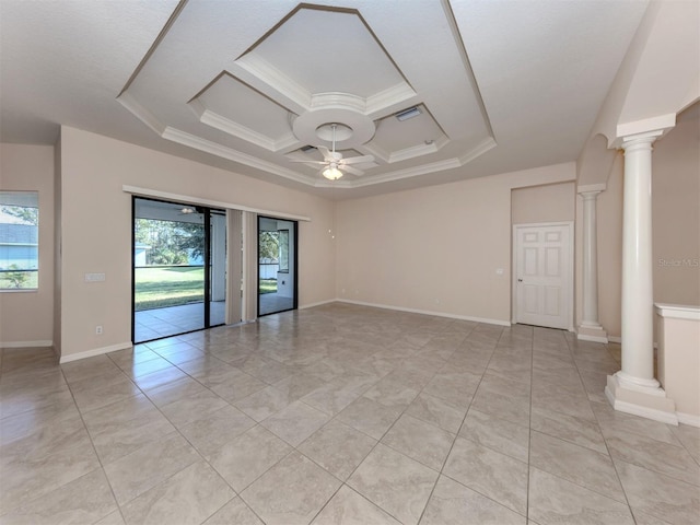 unfurnished room featuring plenty of natural light, ceiling fan, a raised ceiling, and ornamental molding