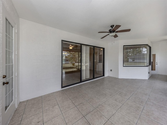 view of patio featuring ceiling fan