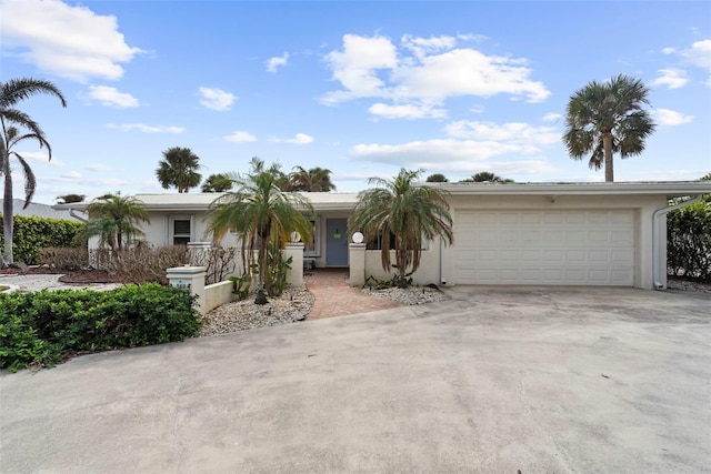 single story home with a garage