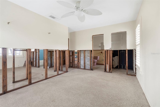 empty room with carpet flooring and ceiling fan