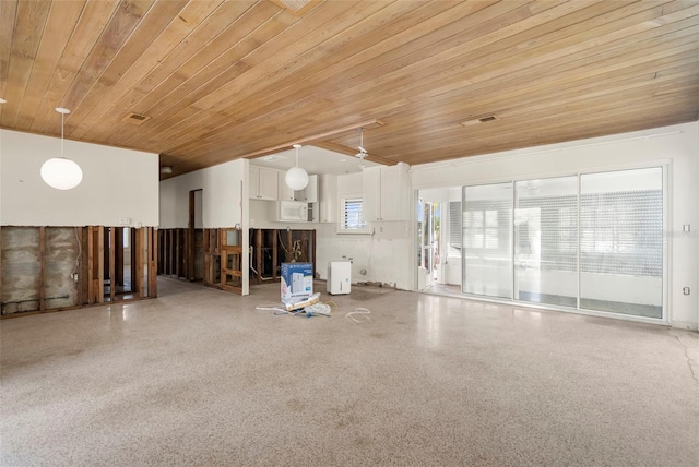 interior space featuring wooden ceiling and a wealth of natural light