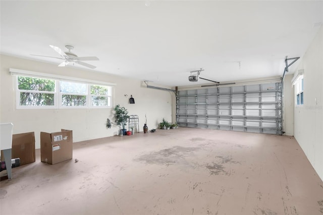 garage with a garage door opener and ceiling fan