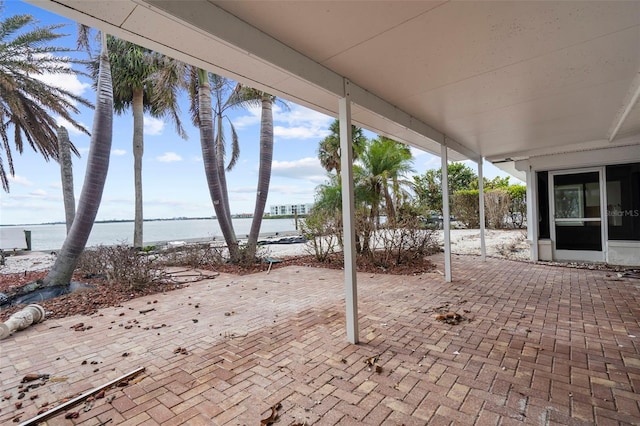 view of patio with a water view