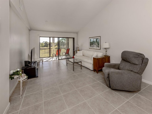 tiled living room with high vaulted ceiling