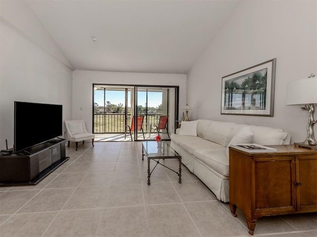 living room with light tile patterned flooring and lofted ceiling