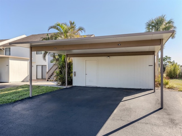 garage featuring a carport