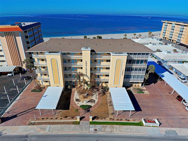 view of property featuring a water view and a view of the beach