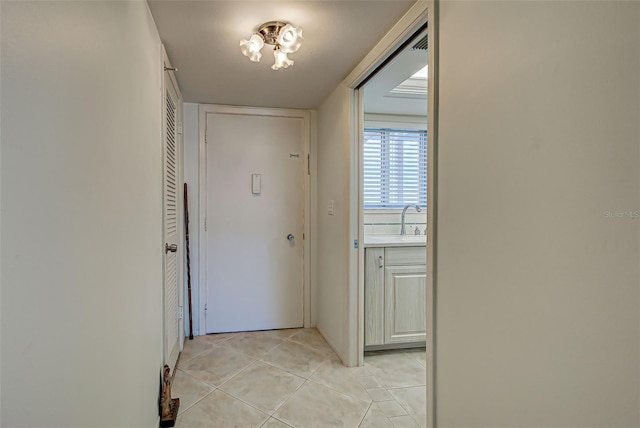 doorway featuring light tile patterned floors