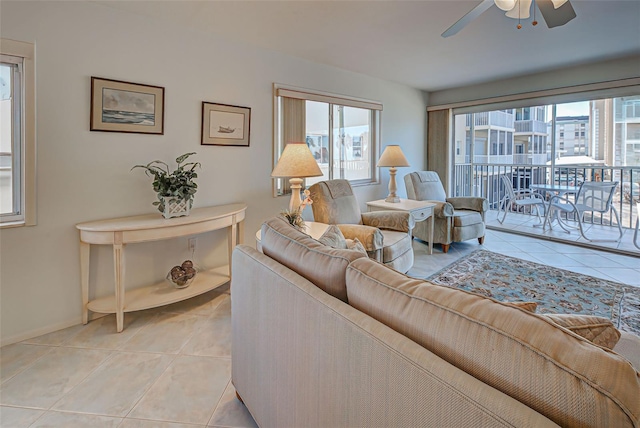 living room with ceiling fan and light tile patterned floors