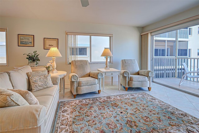 tiled living room with ceiling fan