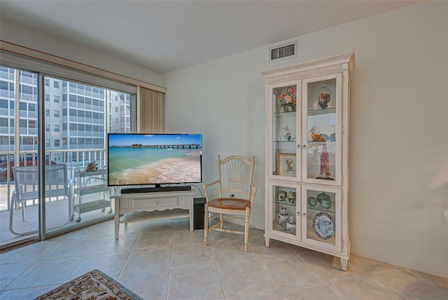 sitting room with light tile patterned floors