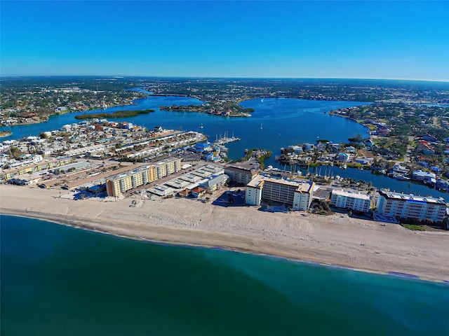 drone / aerial view with a water view and a view of the beach