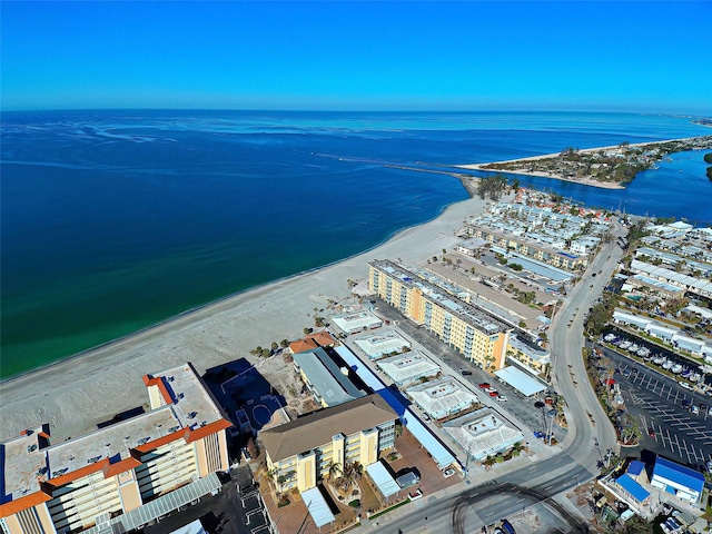 birds eye view of property with a beach view and a water view