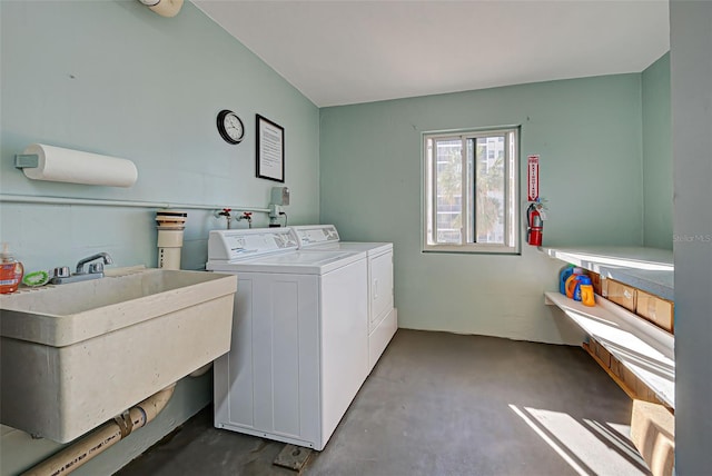 laundry area featuring separate washer and dryer and sink