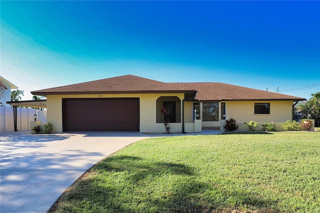 ranch-style home with a garage and a front yard