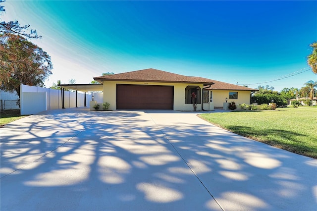 view of front of house featuring a front yard and a garage