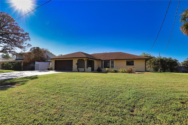 single story home featuring a front yard and a garage