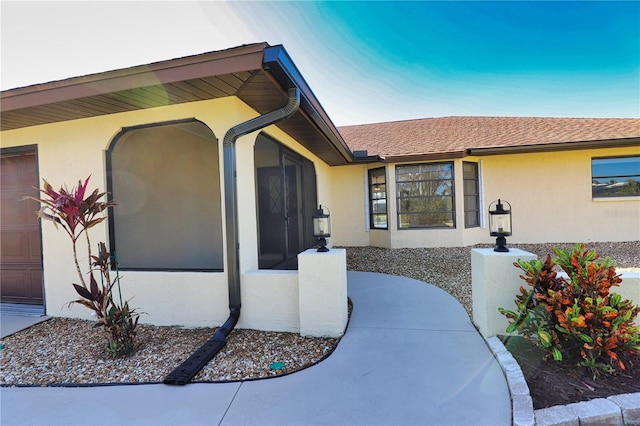 doorway to property with a garage