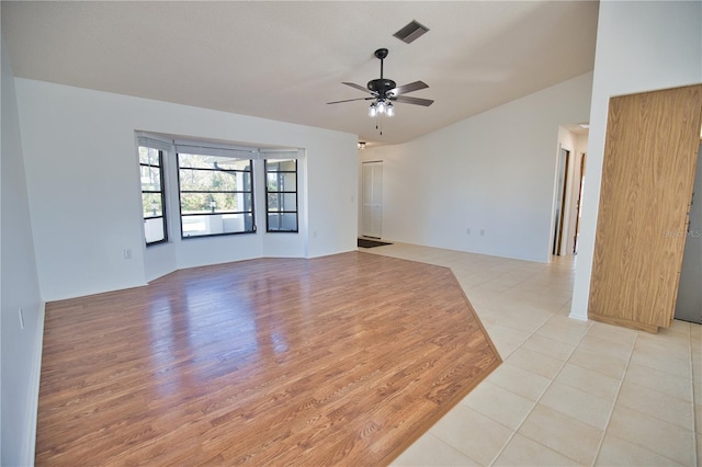 spare room with light hardwood / wood-style flooring and ceiling fan