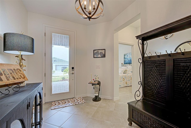 foyer entrance featuring light tile patterned floors and a chandelier