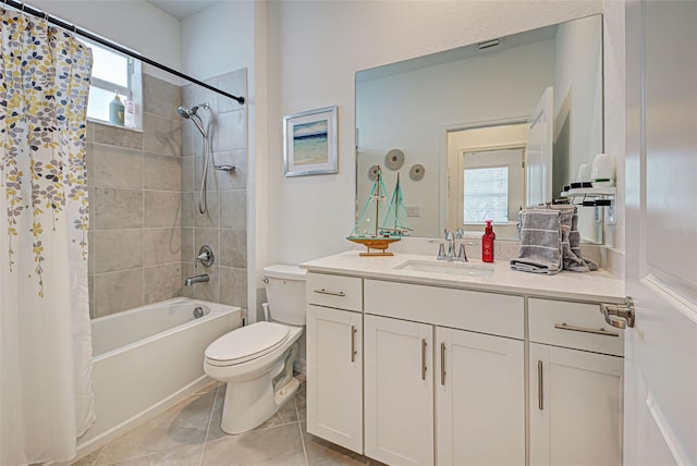 full bathroom featuring tile patterned flooring, vanity, shower / bath combo, and toilet